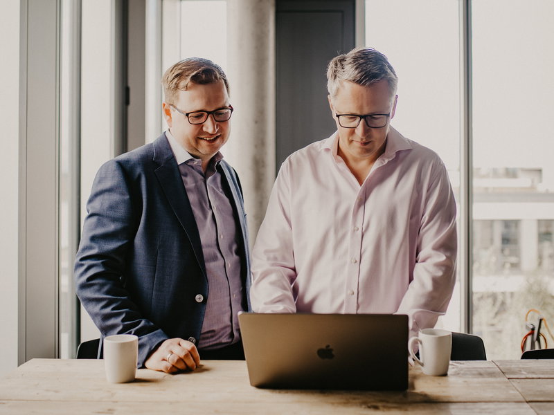 The two founders at the laptop